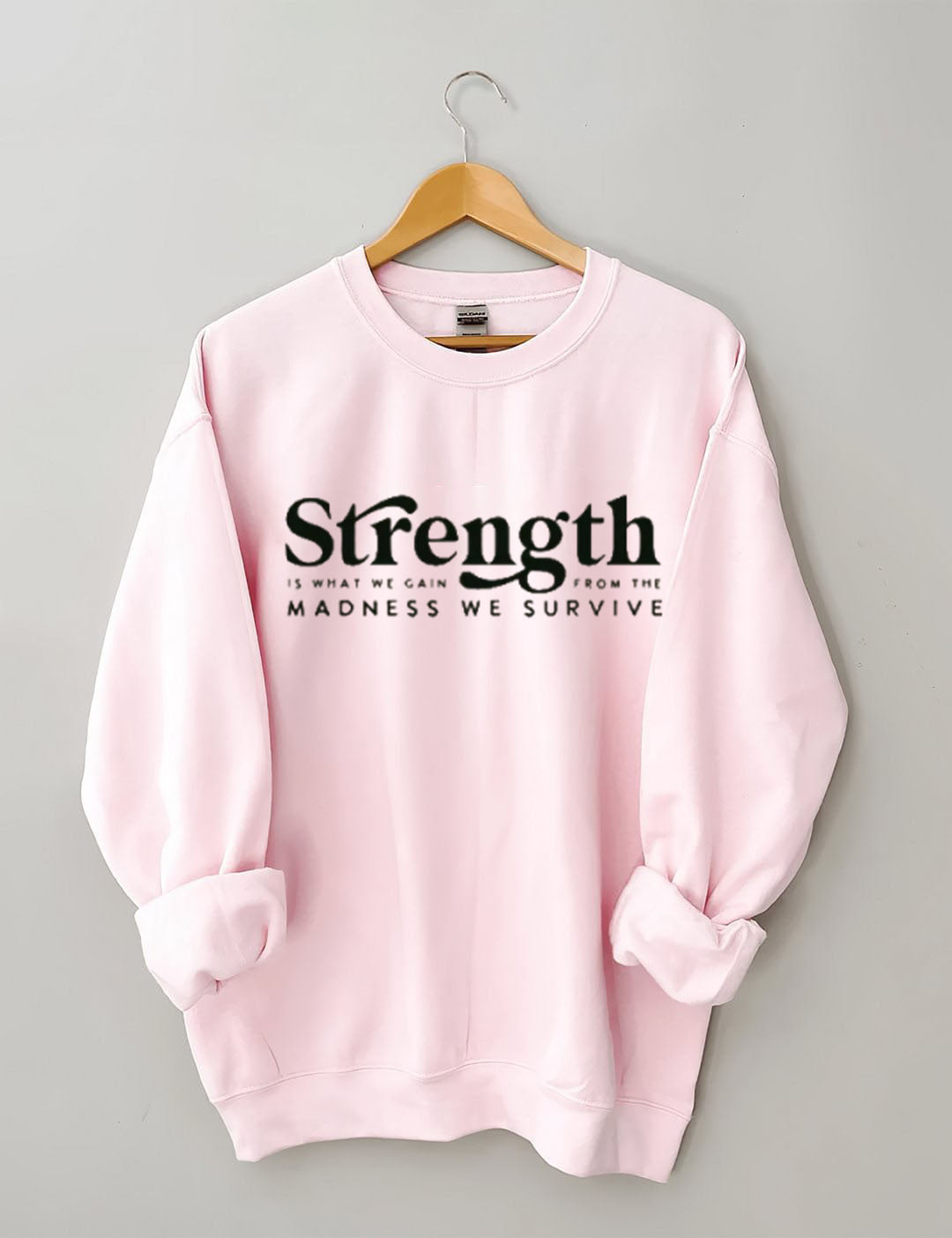 Strength Is What We Gain From The Madness We Survive Sweatshirt