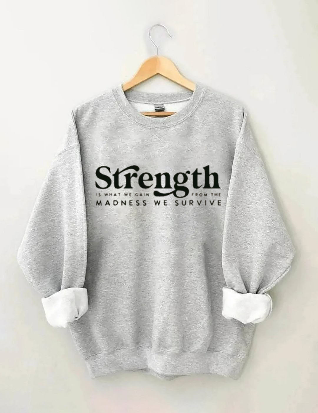 Strength Is What We Gain From The Madness We Survive Sweatshirt