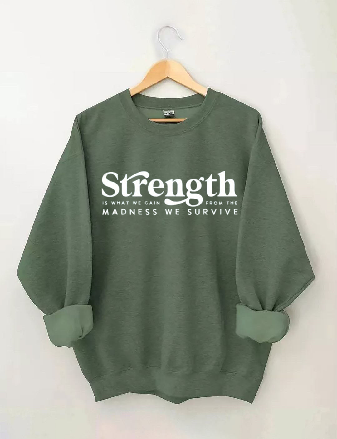 Strength Is What We Gain From The Madness We Survive Sweatshirt